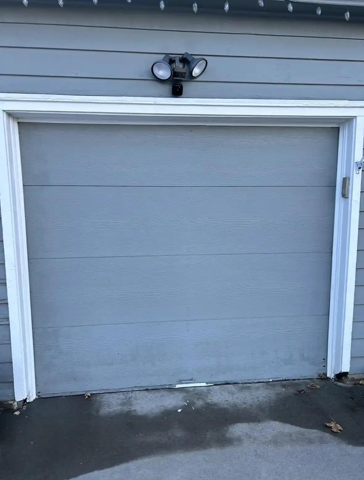Closed gray sectional garage door